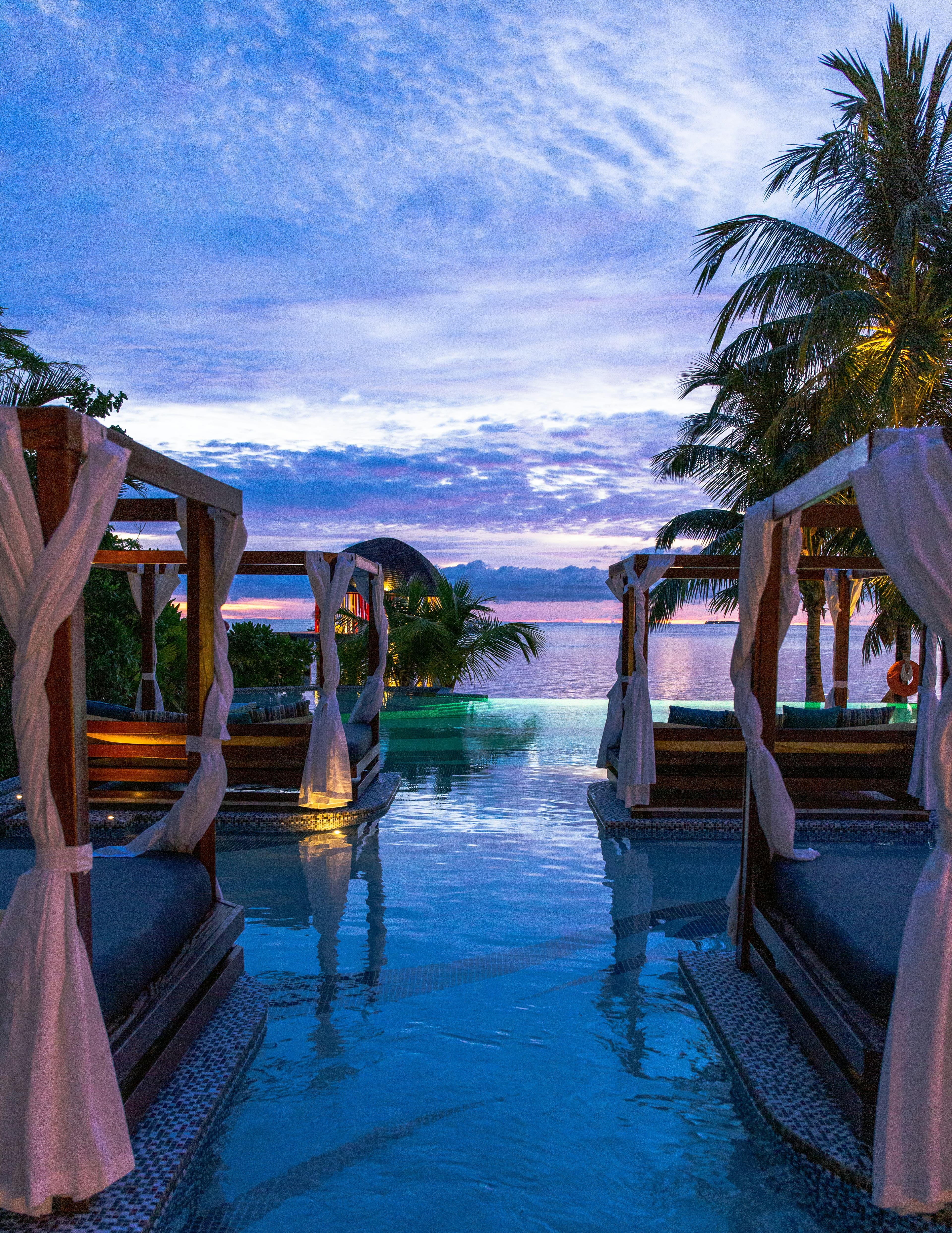 Poolside cabanas at dusk
