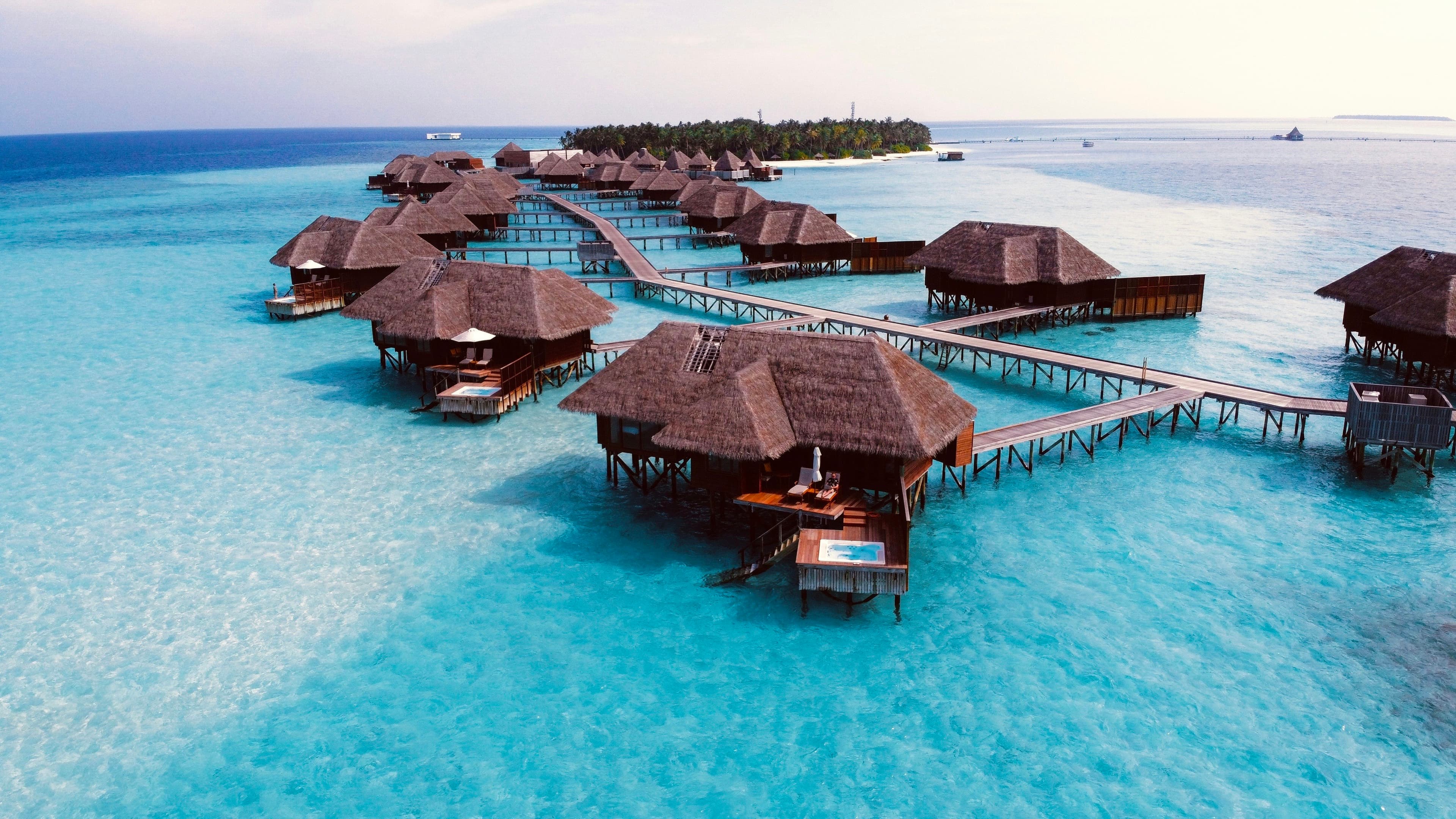 Overwater villas on a turquoise lagoon