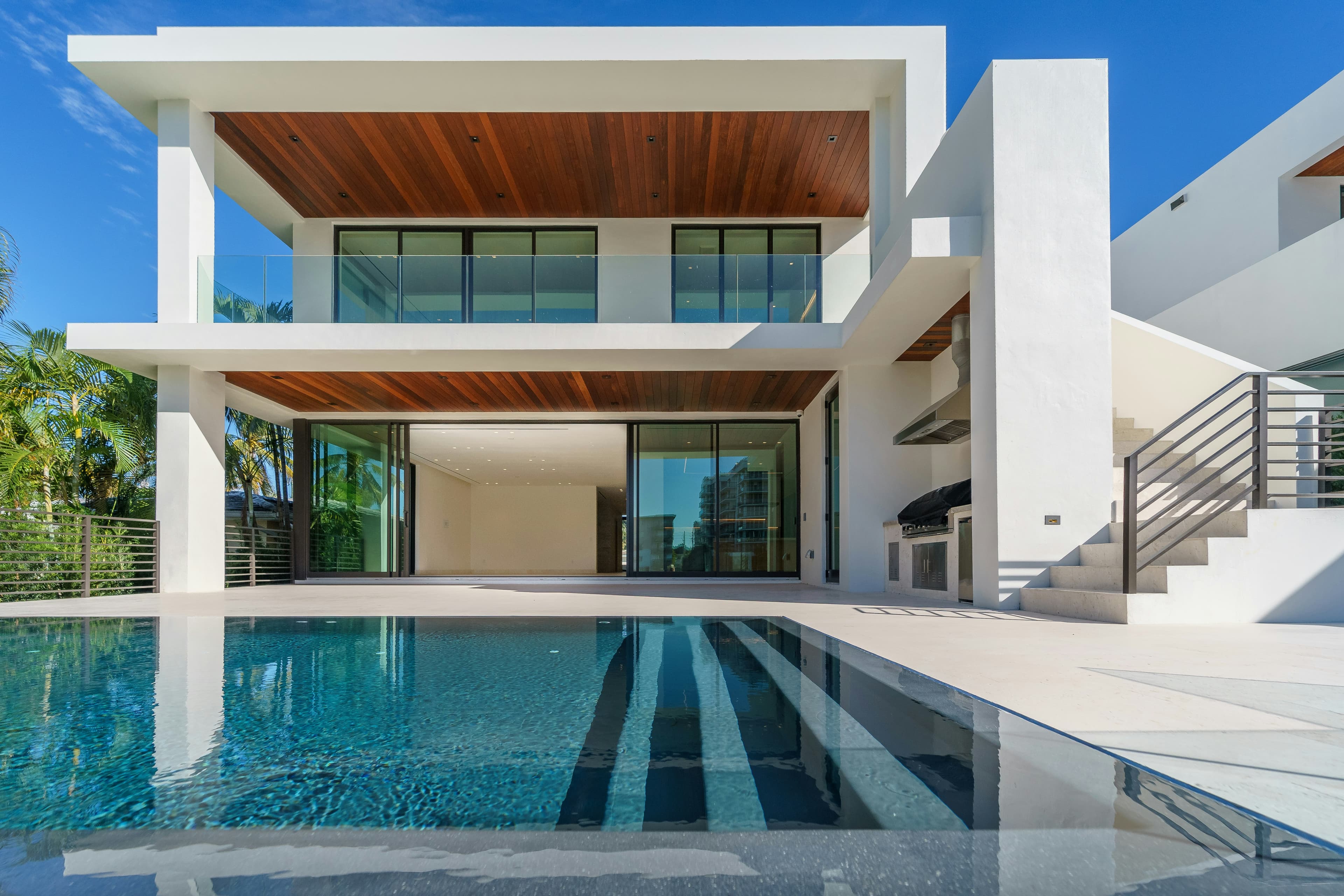 A modern villa beside a long pool